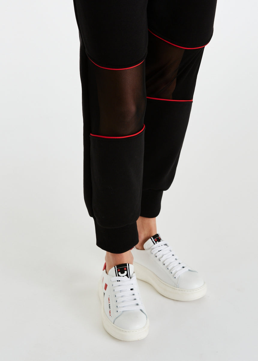 PANTALONE JOGGER DSG IN FELPA NERA CON INSERTO IN RETE E PIPING ROSSO
